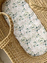 Load image into Gallery viewer, Baby moses basket with eucalyptus foliage print sheet on mattress