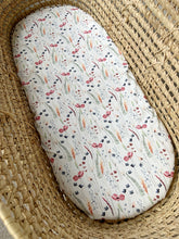 Load image into Gallery viewer, Baby moses basket with poppy and foliage print sheet on mattress