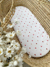 Load image into Gallery viewer, Baby moses basket with pink heart sheet on mattress
